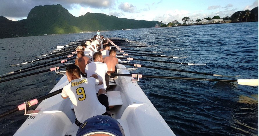 Fautasi longboats racing in Pago Pago Harbor on Flag Day