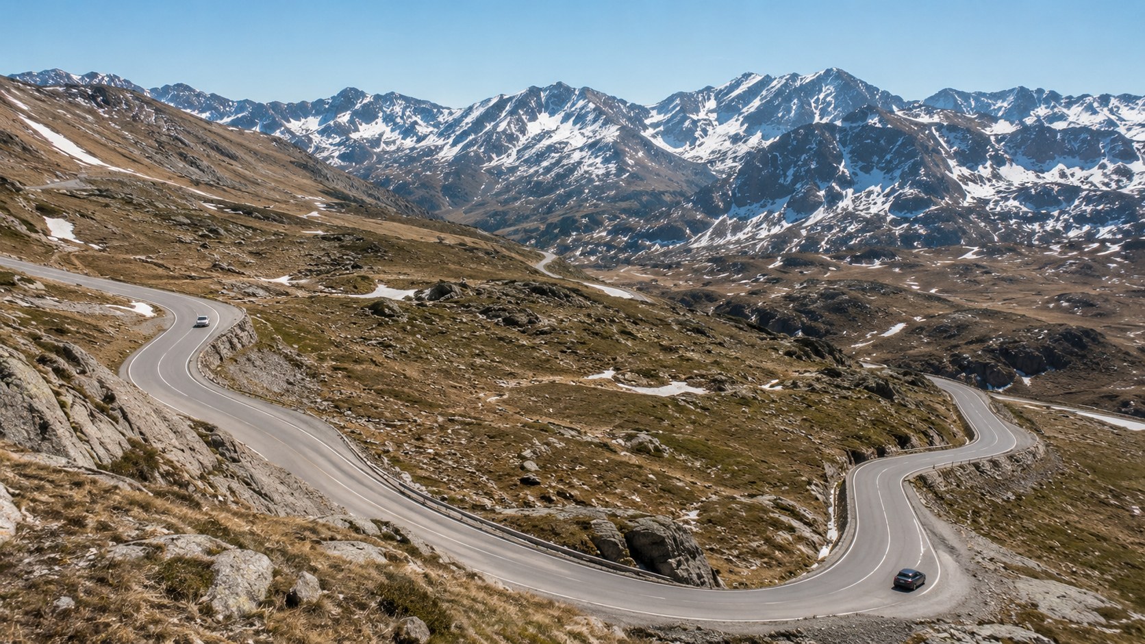 Port d'Envalira mountain pass road winding through snow-dusted peaks