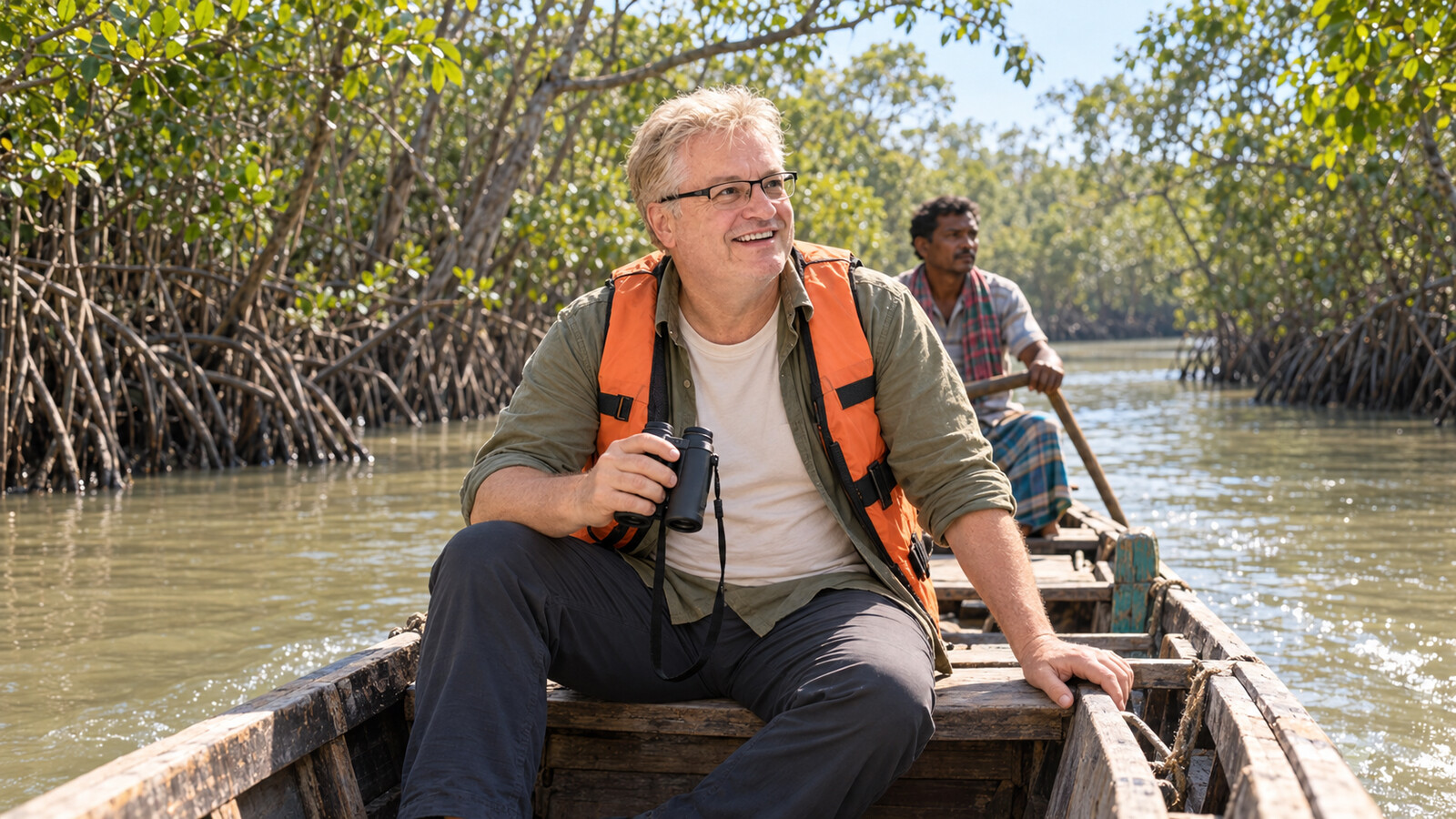 Radim Kaufmann travelling by wooden boat through the Sundarbans mangroves