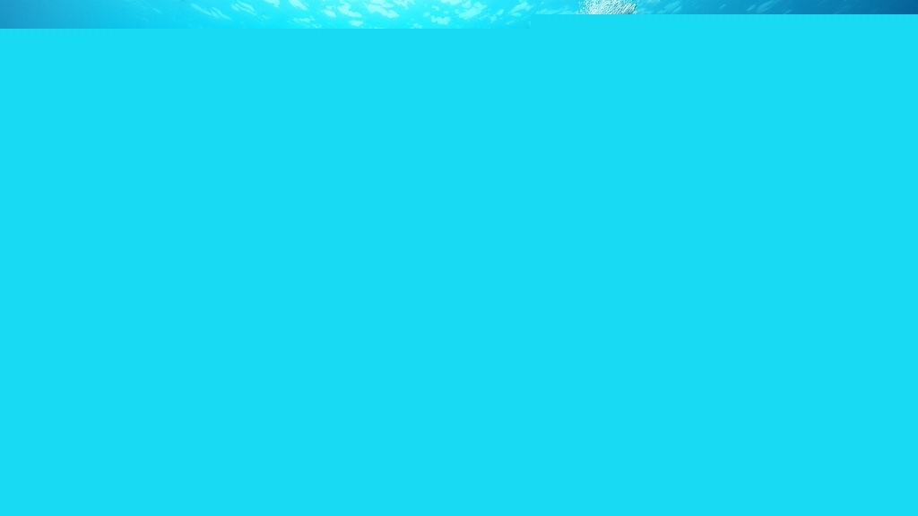 A diver explores Niue's extraordinary underwater world — visibility regularly exceeds 60 metres, making this some of the clearest diving water on Earth