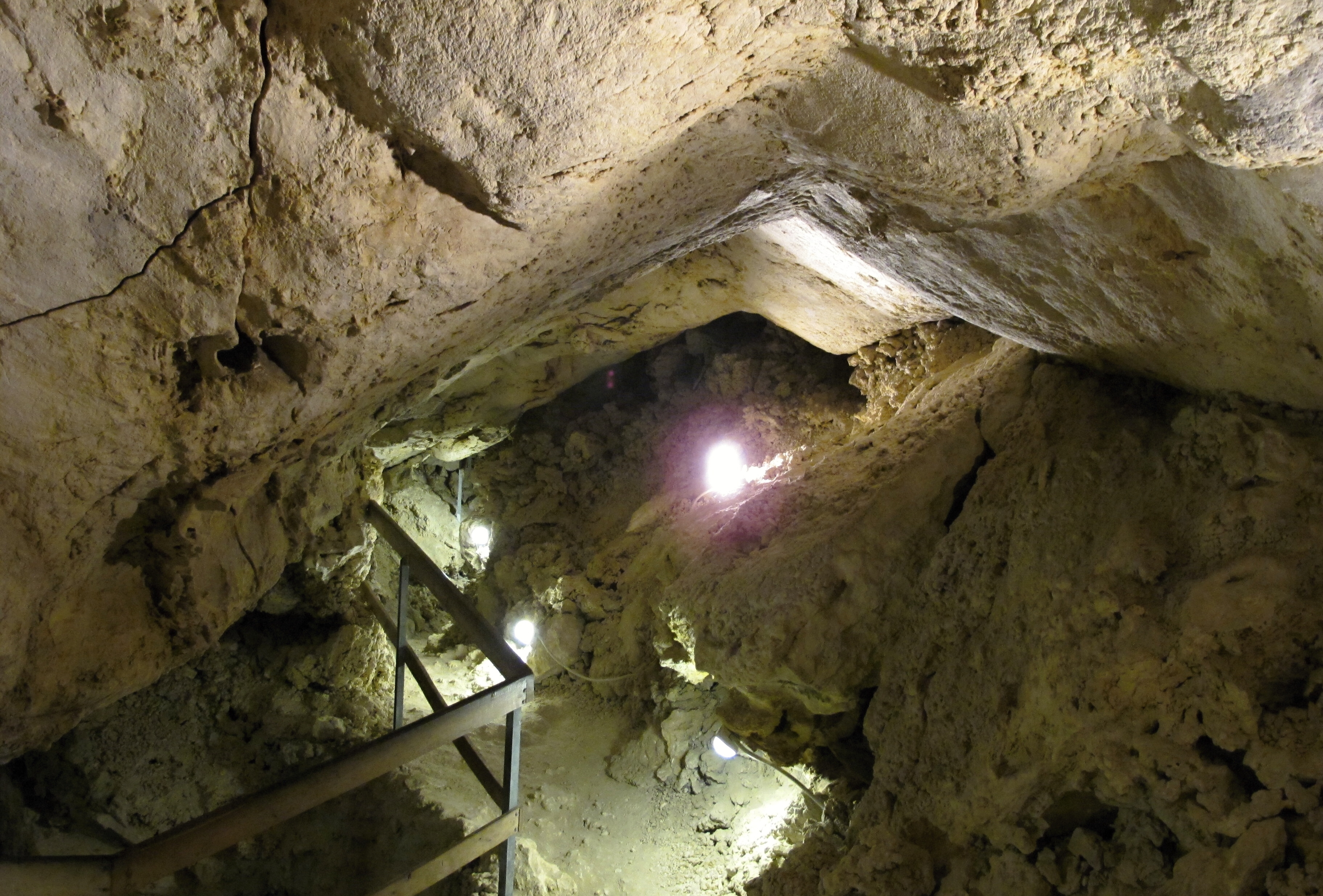 Coral-like white rock formations inside Na Turoldu cave