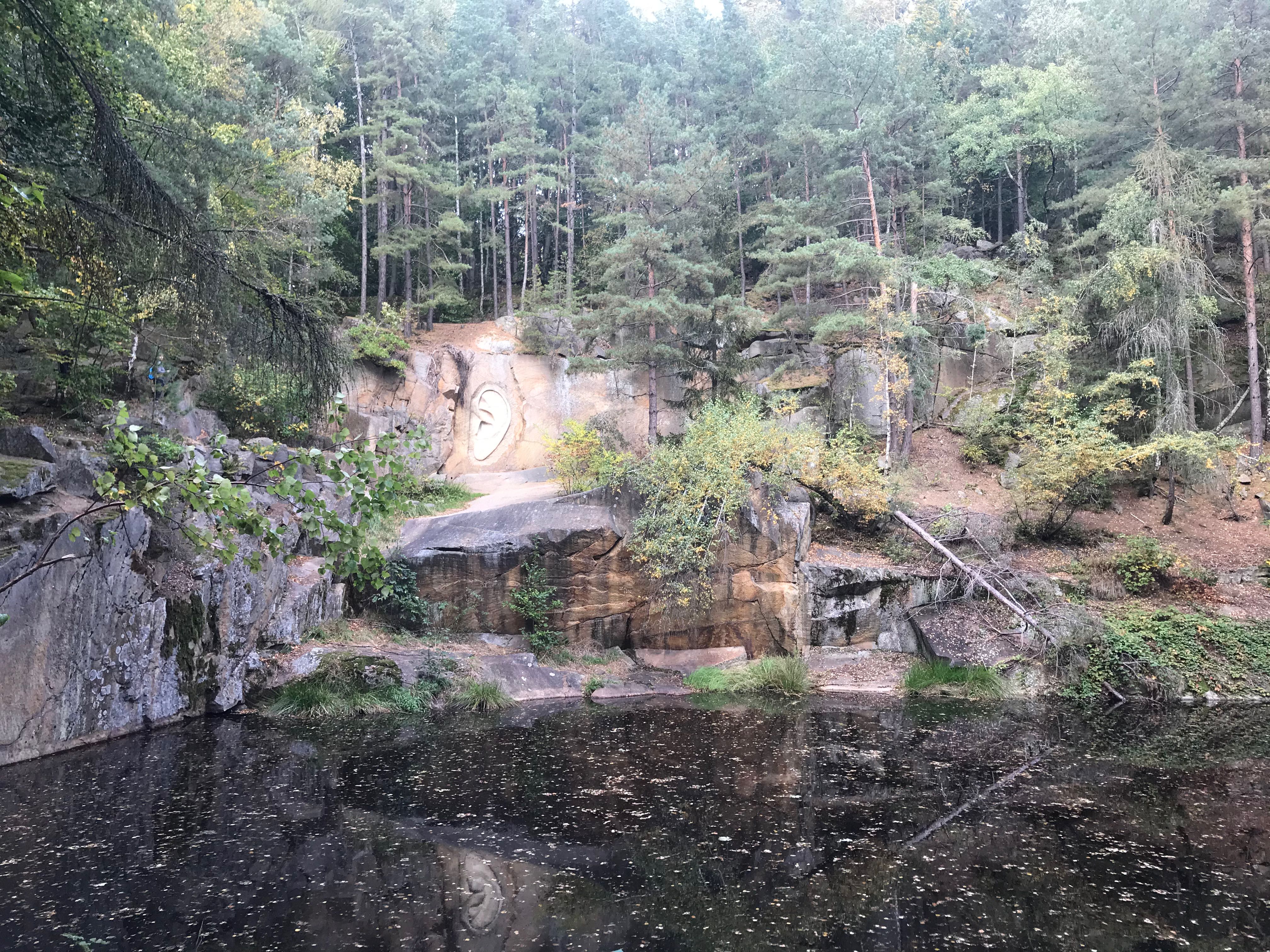 Giant granite ear carved into quarry rock face at Lipnice