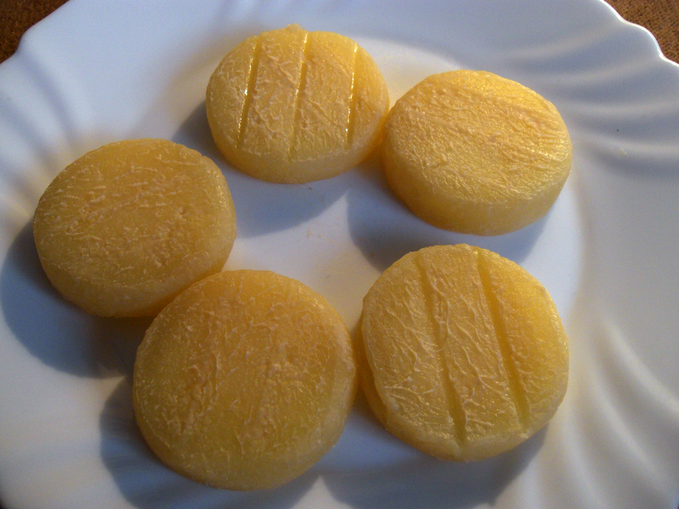 Round pieces of Olomoucke tvaruzky cheese on a plate