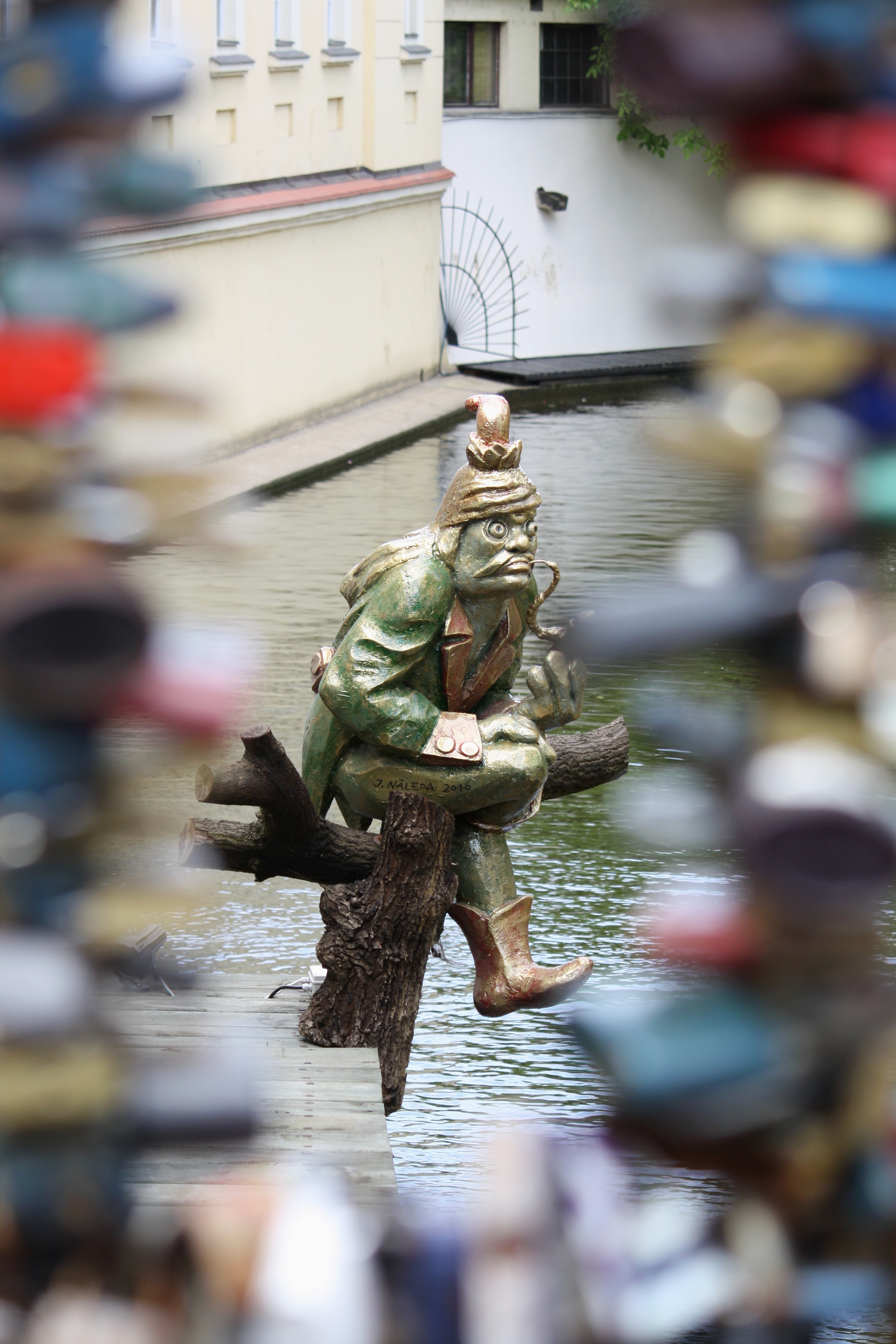 Bronze statue of Kabourek the water sprite on the Certovka canal