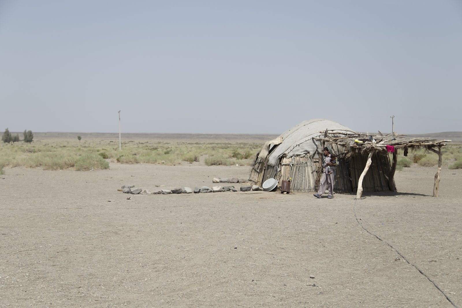A Baloch family dwelling in the desert of Sistan-Baluchestan province, Iran