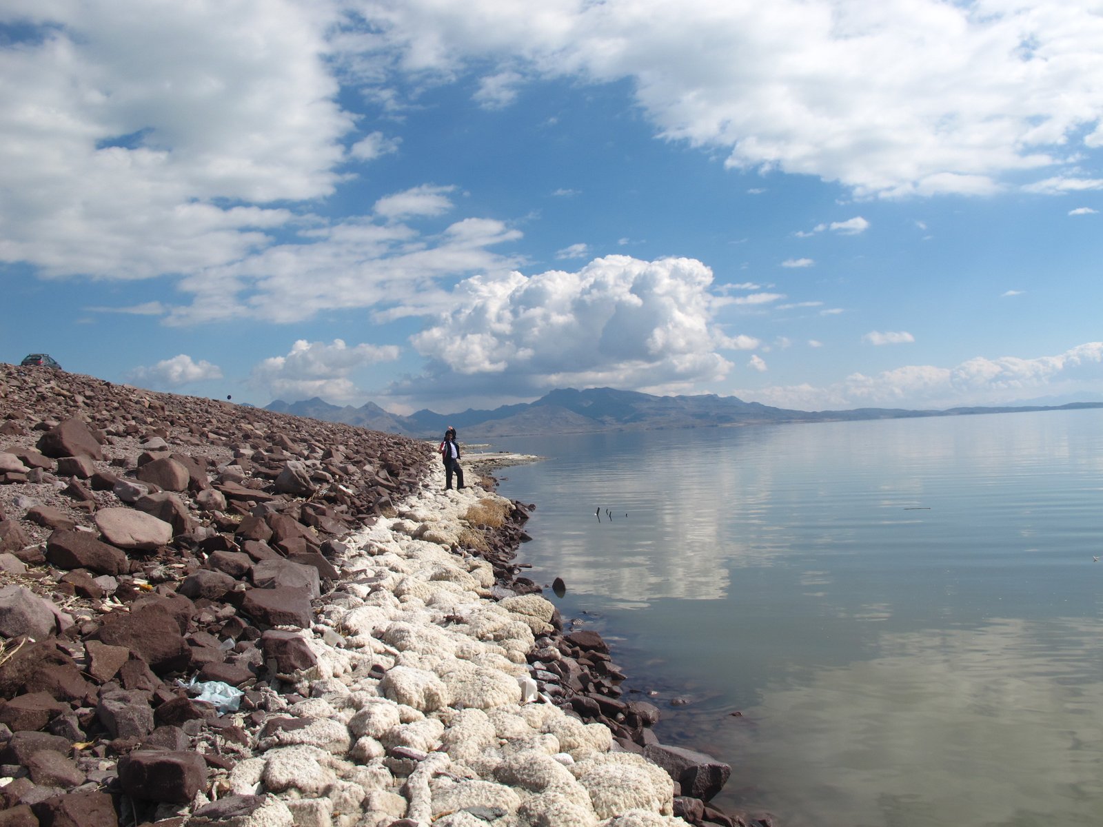 Lake Urmia salt lake shoreline in Iran with mountains in the background