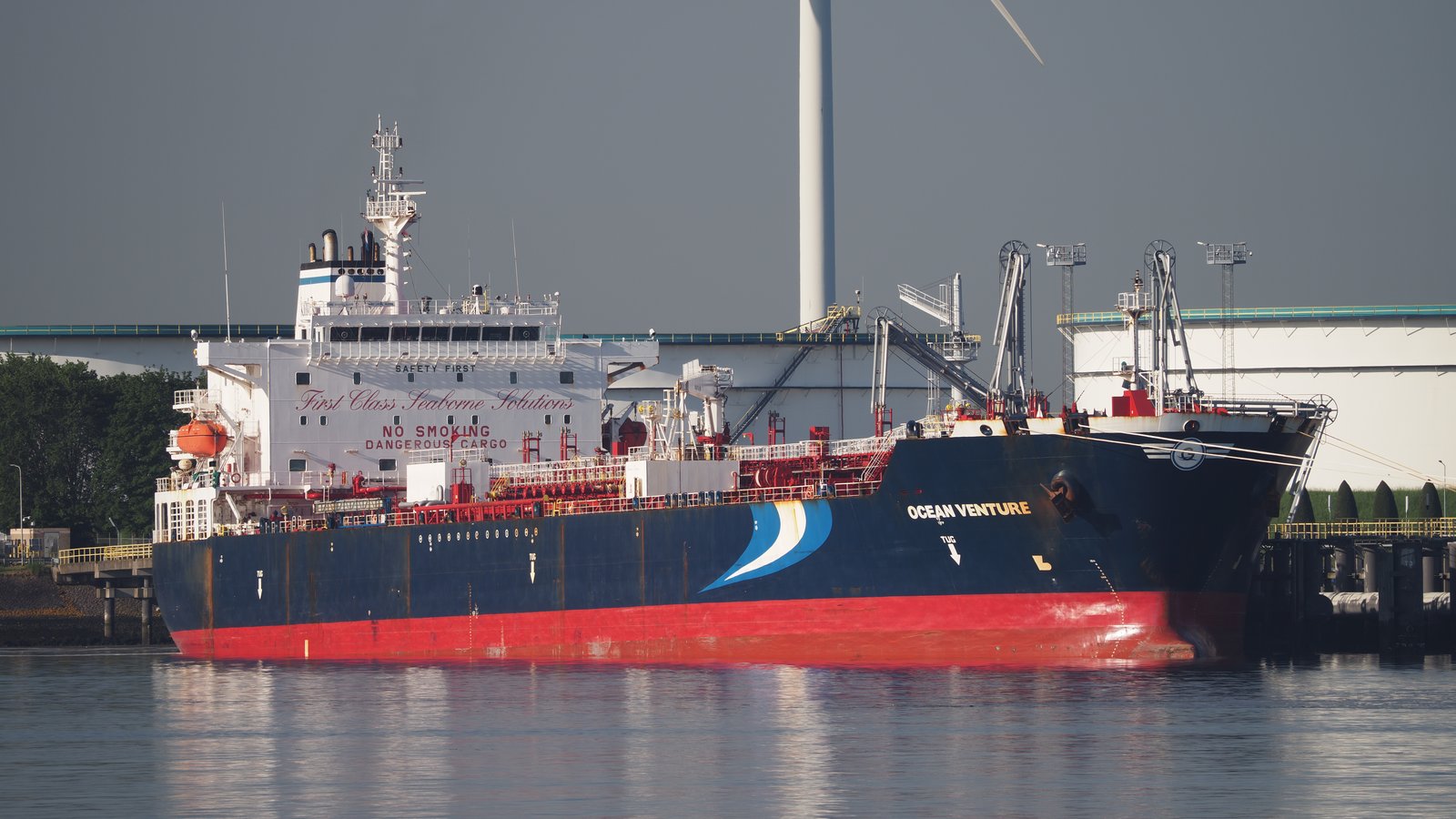 A large oil tanker at dock, illustrating the type of vessel that transits the Strait of Hormuz