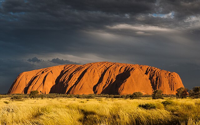 Uluru glowing red at sunset