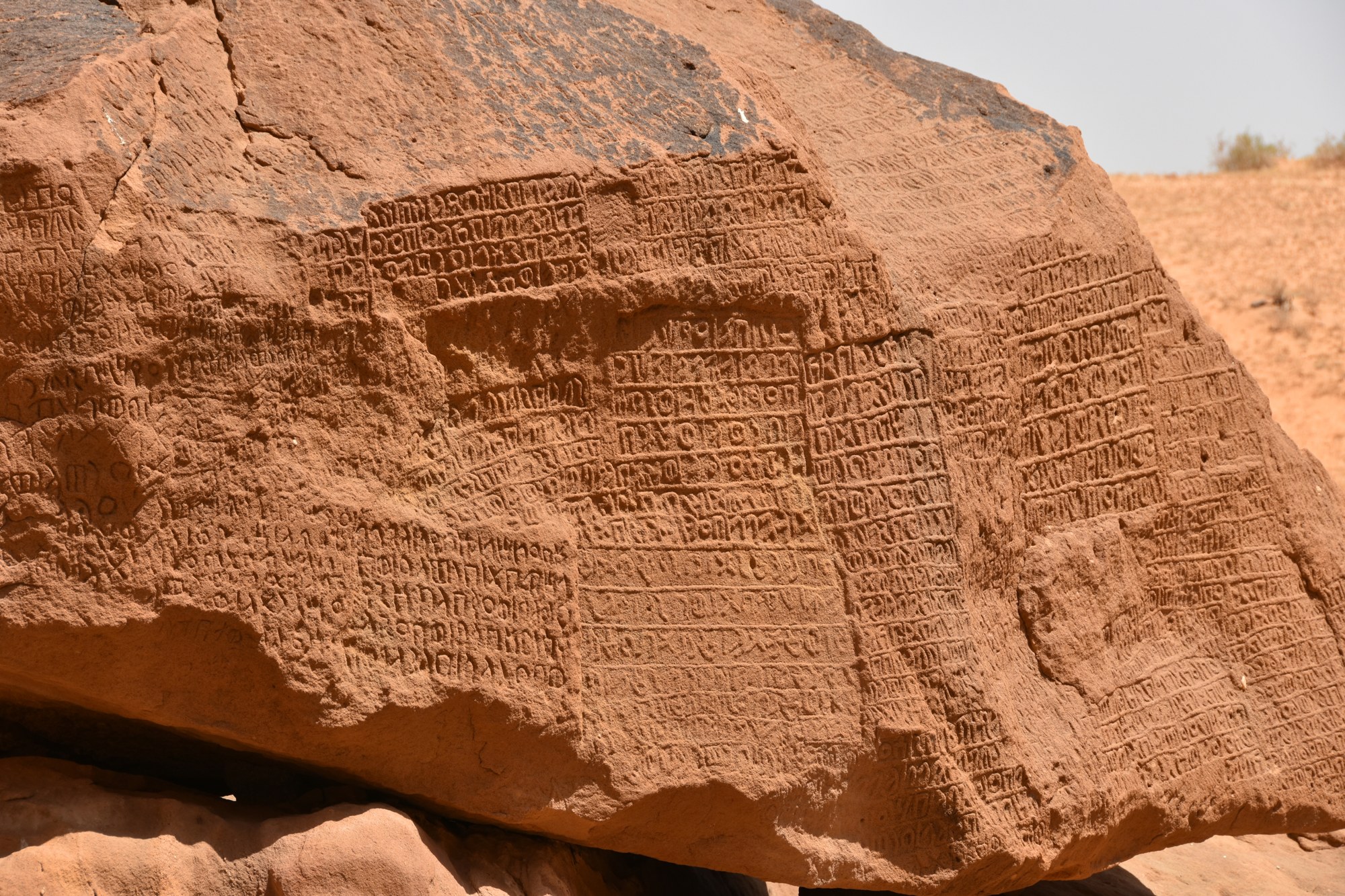 Jabal Ikmah, ancient rock inscriptions carved into red sandstone in AlUla